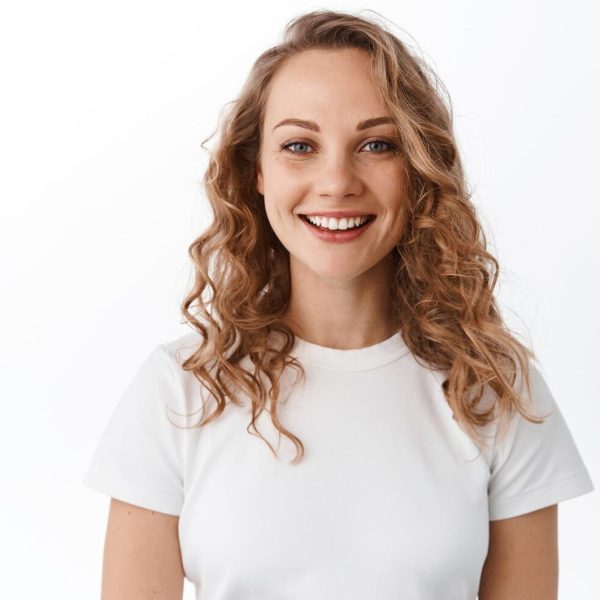 smiling-blond-woman-with-white-perfect-smile-natural-face-looking-happy-confident-camera-standing-tshirt-against-white-background_176420-54122